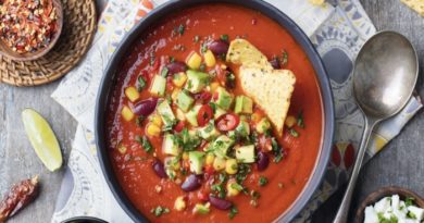 Bowl of taco soup with beans corn and avocado