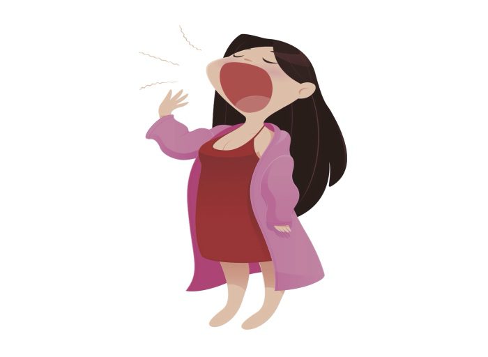 sleepy mom in a pink robe yawning