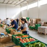 Volunteers packing food boxes inside a bright Texas food bank warehouse